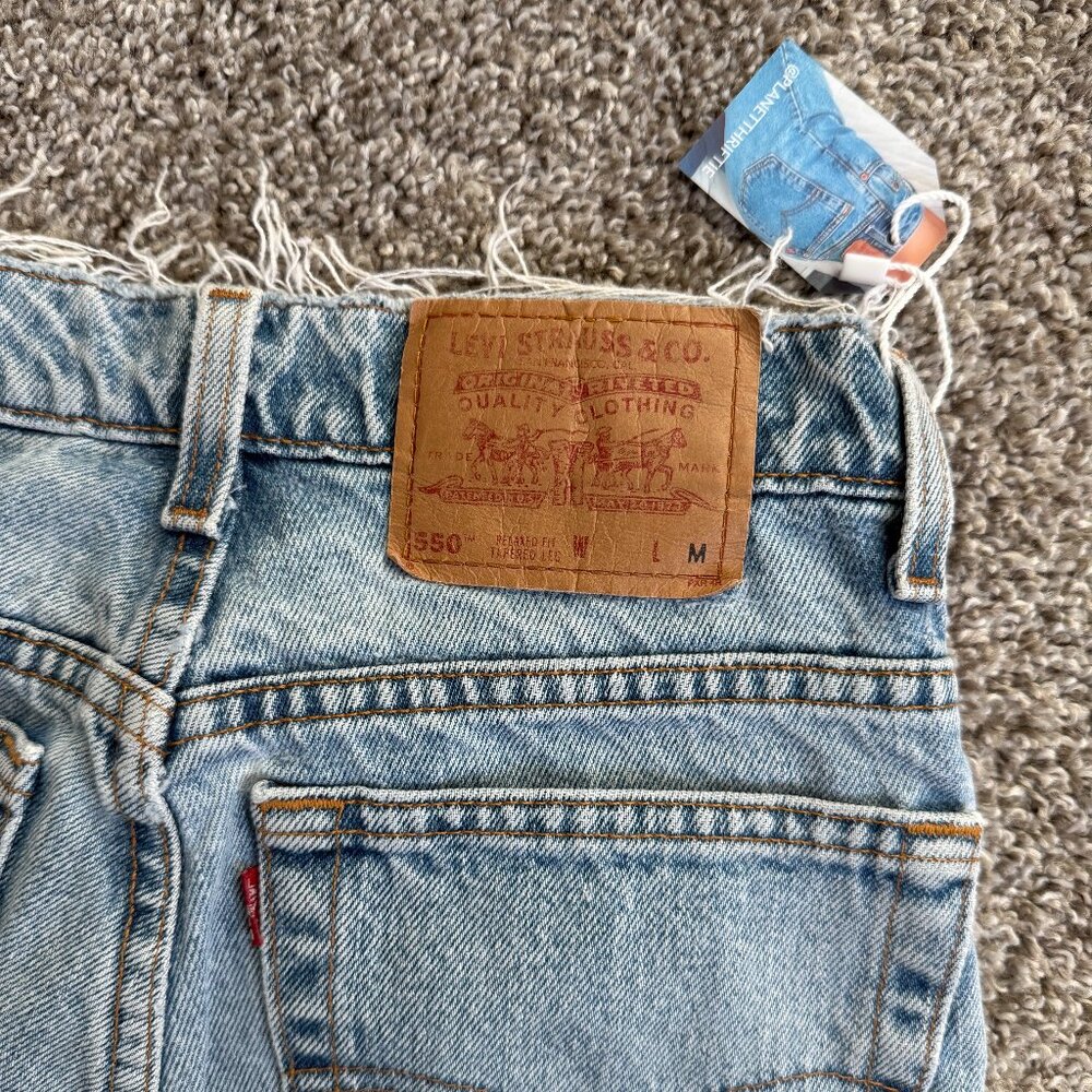 Vintage Womens Levi Jeans 550 Relaxed Fit Tapered Ripped Light Wash Denim 9 JR M